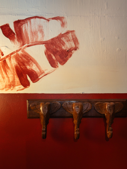 Red & White Painted Walls with Hooks - Beautiful Homes